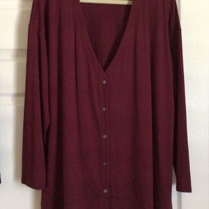 Burgundy cardigan.
